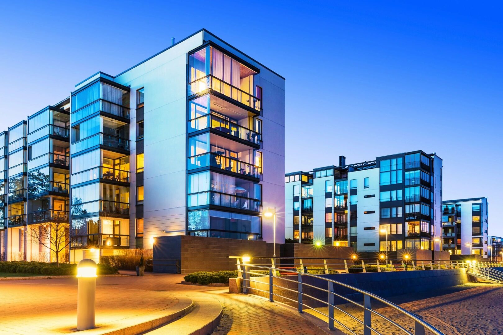 A group of buildings that are lit up at night.