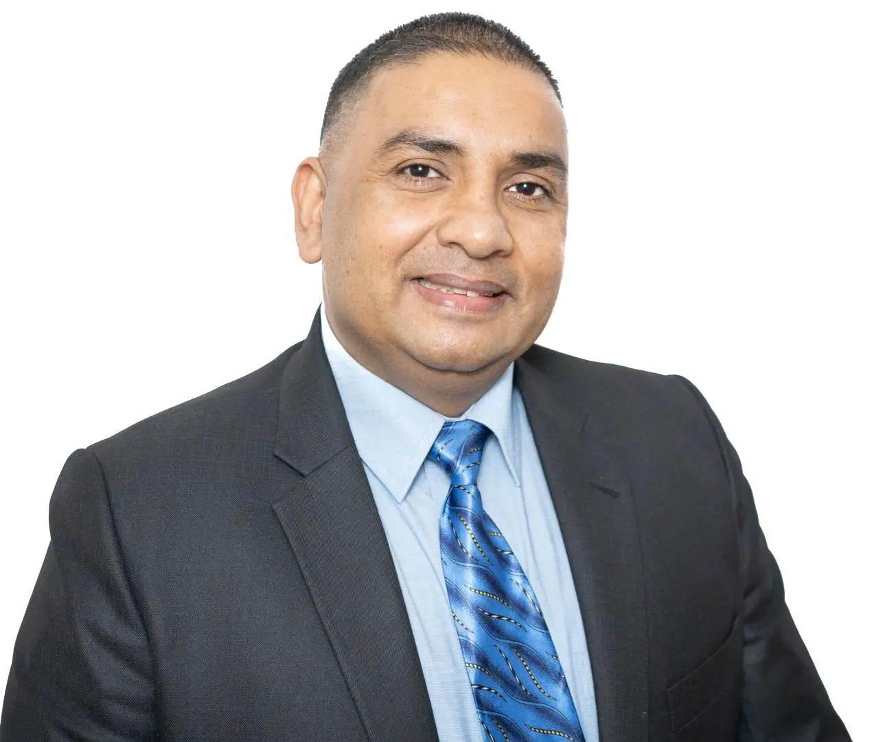 A man in a suit and tie smiling for the camera.